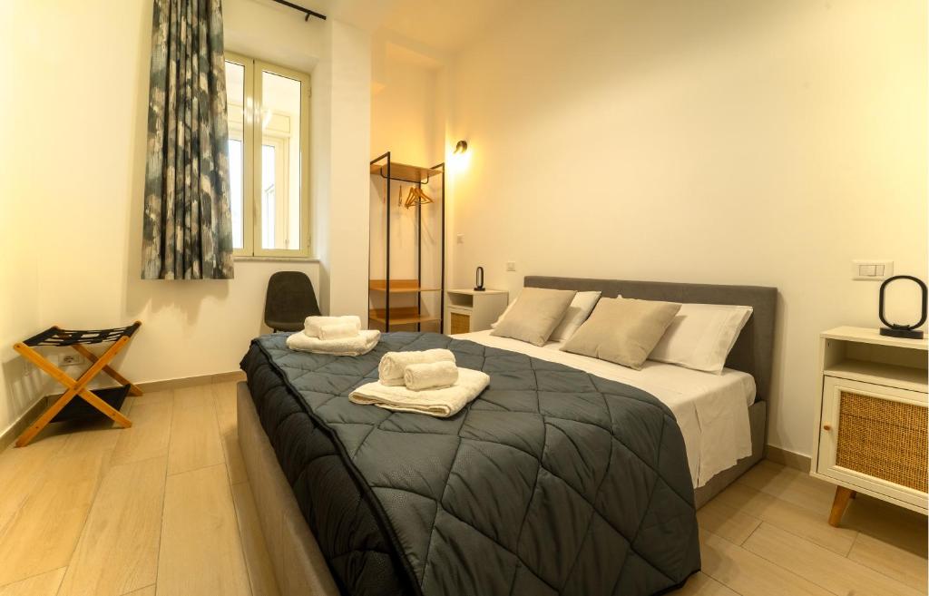 Ένα ή περισσότερα κρεβάτια σε δωμάτιο στο Le rose di Mimmo Casa vacanze