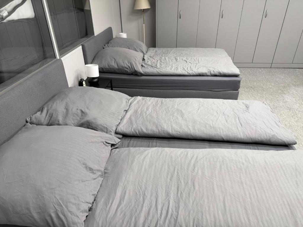 Кровать или кровати в номере Monteur-Apartments Nürtingen - Work and Relax NB