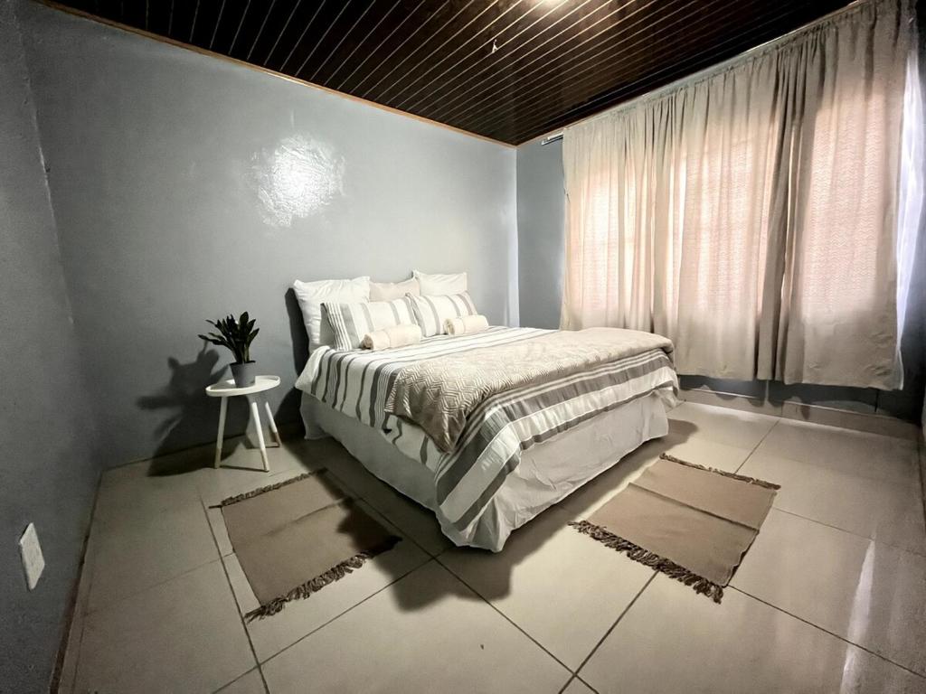 En eller flere senge i et værelse på Cozy Comfort