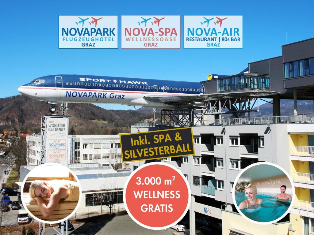 Ein Flugzeug befindet sich auf dem Dach eines Gebäudes mit Schildern. in der Unterkunft NOVAPARK Flugzeughotel Graz in Graz