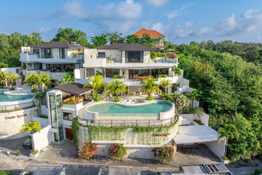 an aerial view of a resort with a swimming pool at Casa Daria Sofia - Ocean Views Infinity Pool Escape with Cinema & Gym in Uluwatu