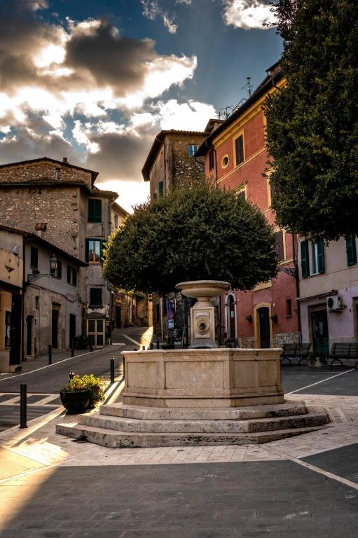 a fountain in the middle of a city street at Casa vacanze Harmonie in Olevano Romano