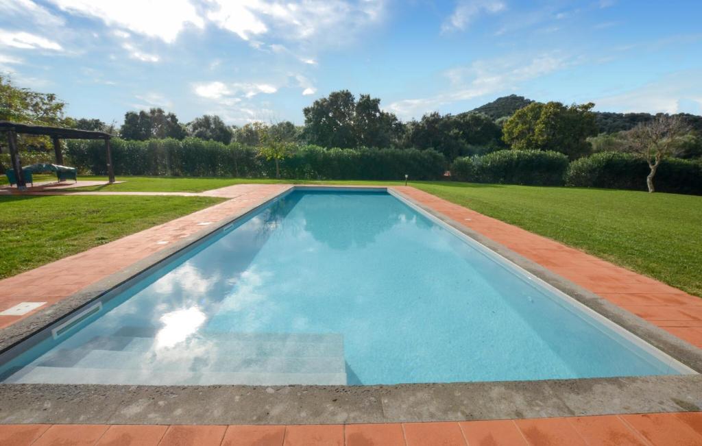 a swimming pool in the middle of a yard at Beautiful Home In Ansedonia in Ansedónia