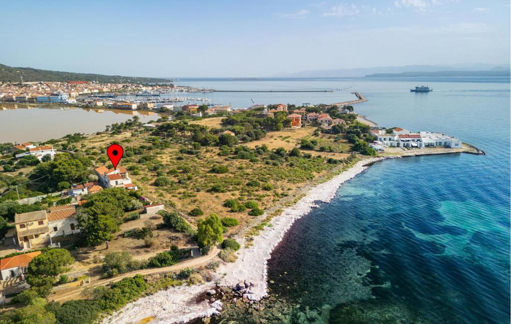 an island with a red marker in the water at Stunning Home In Carloforte With Wifi in Carloforte