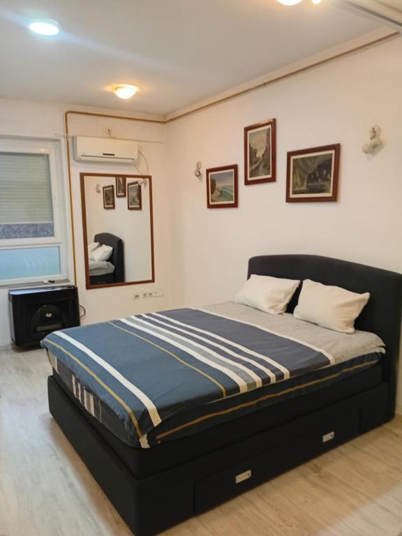 Postel nebo postele na pokoji v ubytování Sindi Apartman