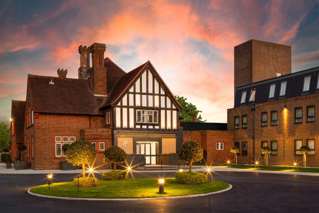 a rendering of a house with lights in front of it at Holiday Inn London-Bexley by IHG in Bexley