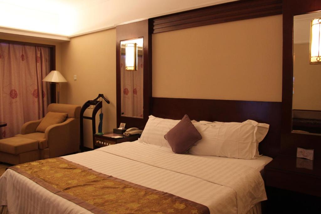 Postel nebo postele na pokoji v ubytování Sunshine Holiday Hotel Fuzhou