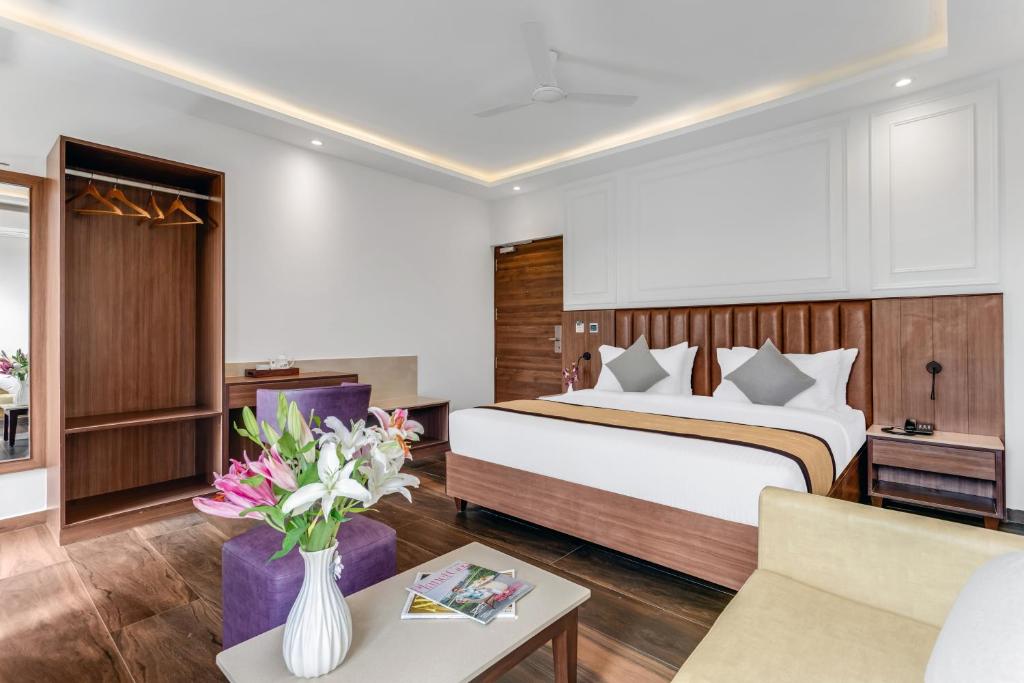 Postel nebo postele na pokoji v ubytování SinQ Symbol