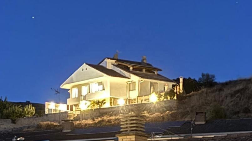 a large white house on top of a hill at El mirador de Teresa in Arróniz
