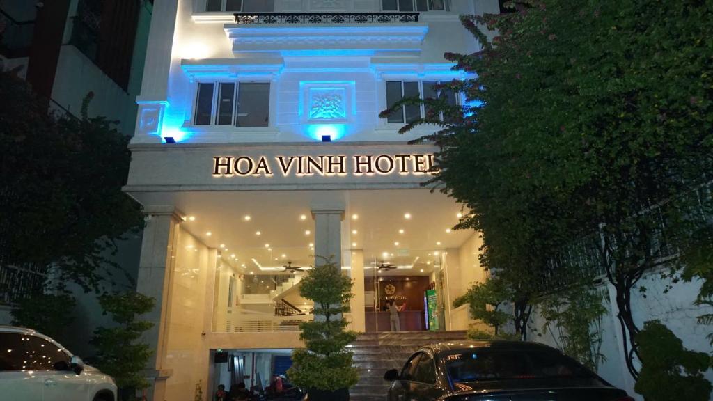 a building with a sign that says hola vin hotel at Khách Sạn Hoa Vinh - Thủ Đức in Ho Chi Minh City