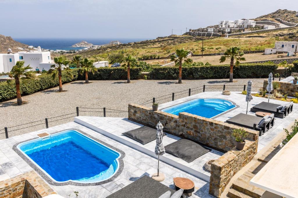 an image of a swimming pool in a resort at Aurora Mykonos Villas in Kalafatis