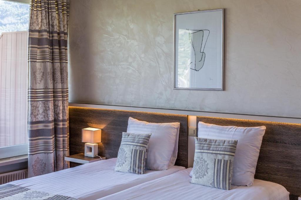 Postel nebo postele na pokoji v ubytování Hotel Castel