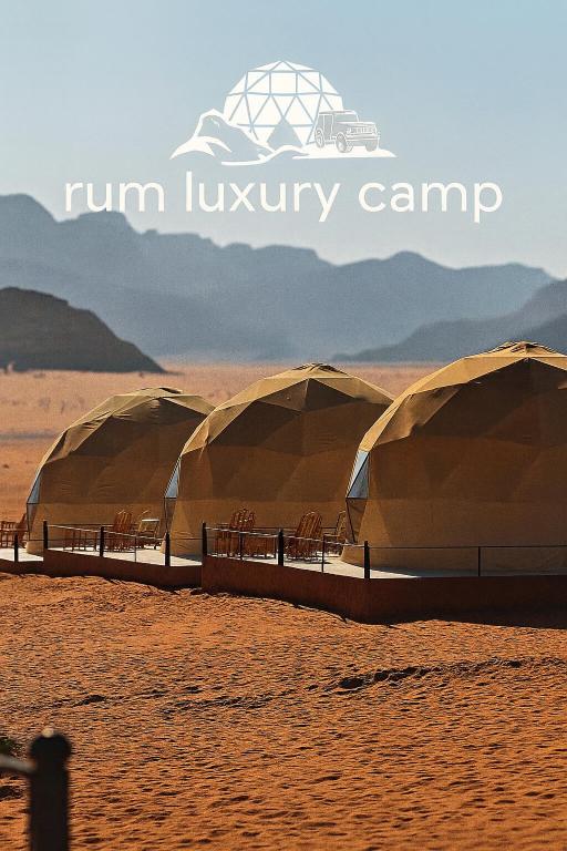 a row of domes in the middle of a desert at RUM LUXURY CAMp in Wadi Rum