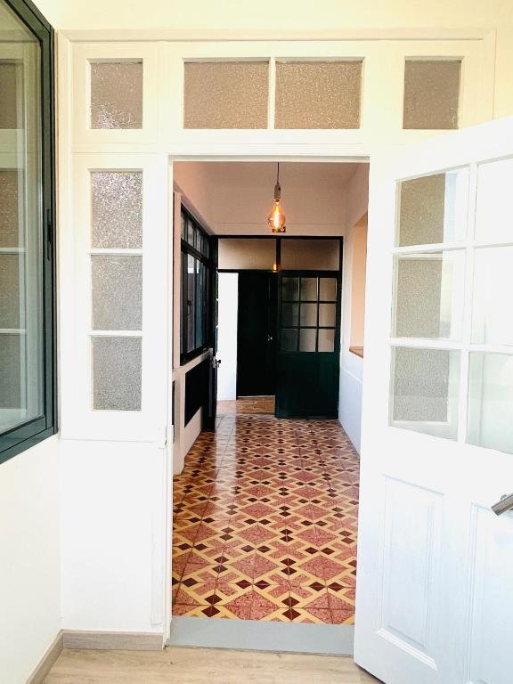 an open door into a hallway with a tile floor at Sunny Escape - Ponta do Sol -- Vila Silva Upstairs in Ponta do Sol
