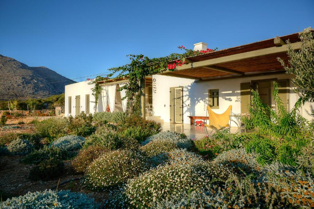 a house with a garden in front of it at Villa Handras-Main villa, by Amorgos Holiday Homes in Amorgos