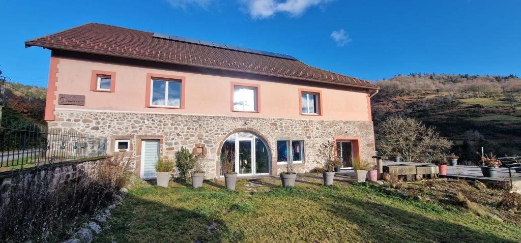 a house on the side of a hill at La Ferme des Cherrieres - Piscine Intérieure Chauffée in Rupt-sur-Moselle
