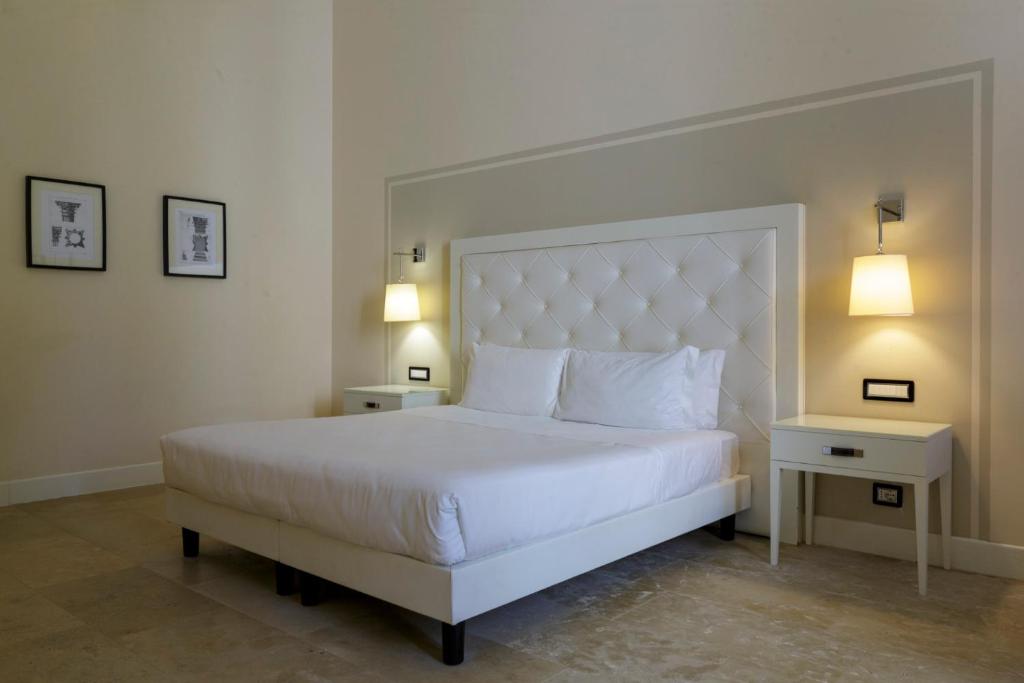 Postel nebo postele na pokoji v ubytování Hotiday Siracusa Floridia