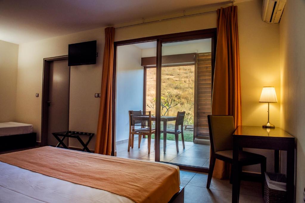 Postel nebo postele na pokoji v ubytování Tama Hotel