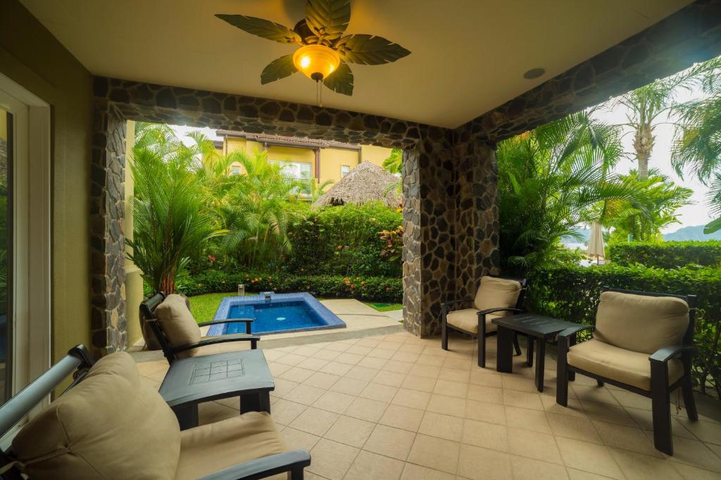 a patio with chairs and a swimming pool at Vista Bahia 3D - 3bdr 3bath plunge pool in La Mona