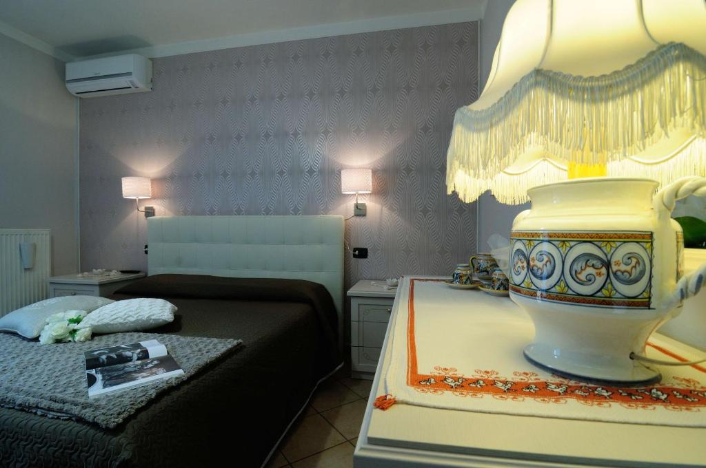 Postel nebo postele na pokoji v ubytování Residenza Cieloterra