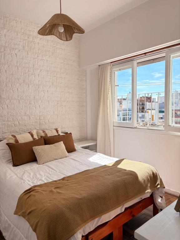 Ένα ή περισσότερα κρεβάτια σε δωμάτιο στο Departamento 2 ambientes PLAZA COLÓN