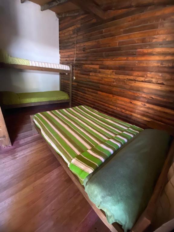 En eller flere senge i et værelse på Hospedaje Tiempo Azul