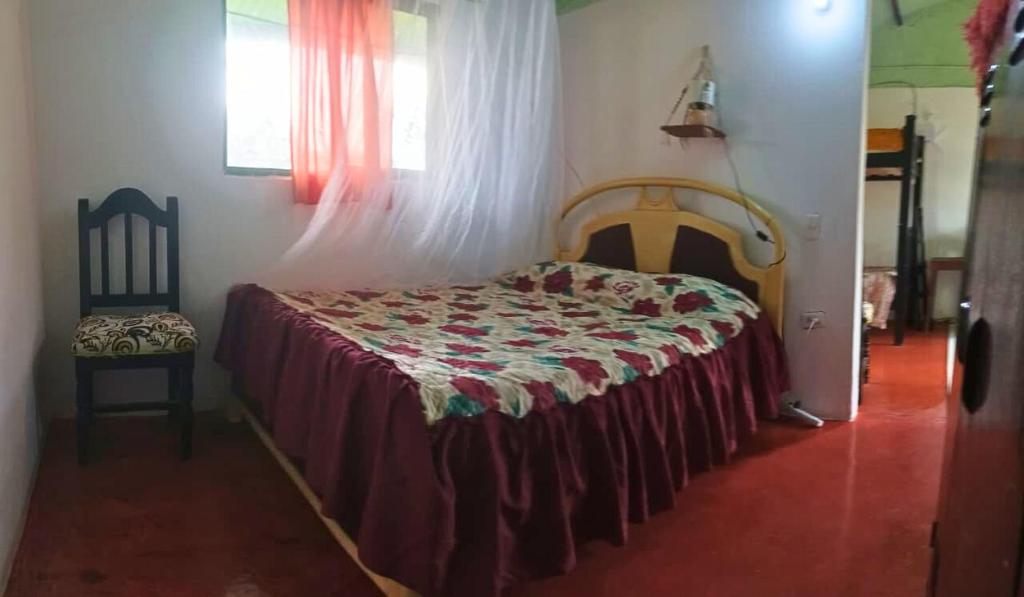 Ένα ή περισσότερα κρεβάτια σε δωμάτιο στο Alma Paisa, Guesthouse