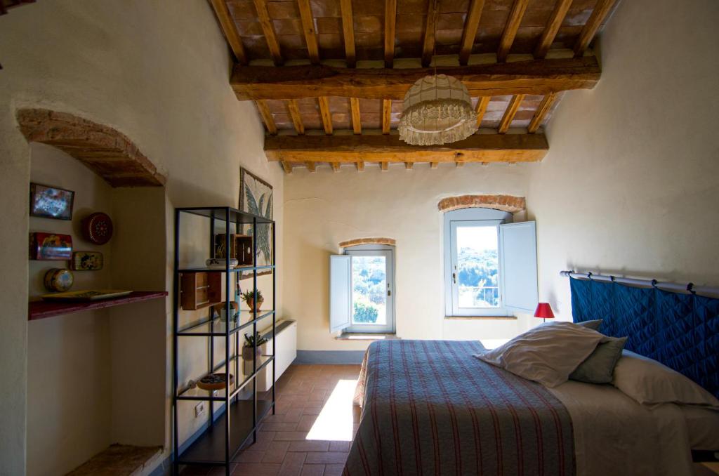 Giường trong phòng chung tại CasaLeMonache - Appartamenti nel Casale Umbro