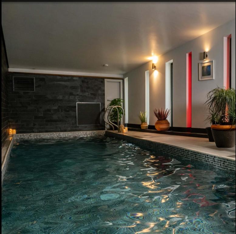 a swimming pool in the middle of a house at The Dome House in Bowness-on-Windermere
