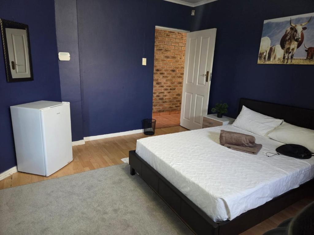 Ένα ή περισσότερα κρεβάτια σε δωμάτιο στο Cozy Corner House