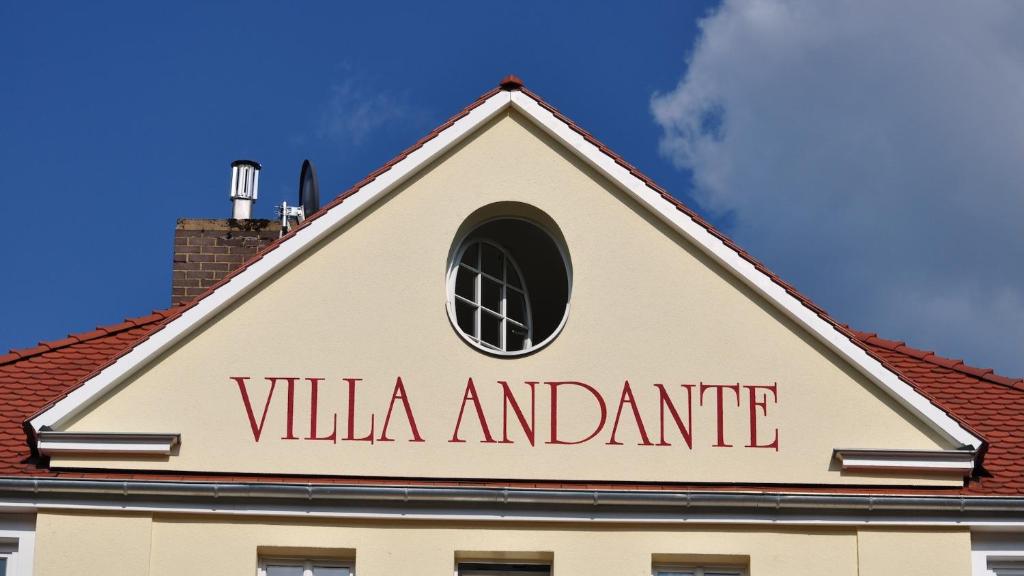 a sign on the top of a building at Villa Andante Apartmenthotel in Kassel