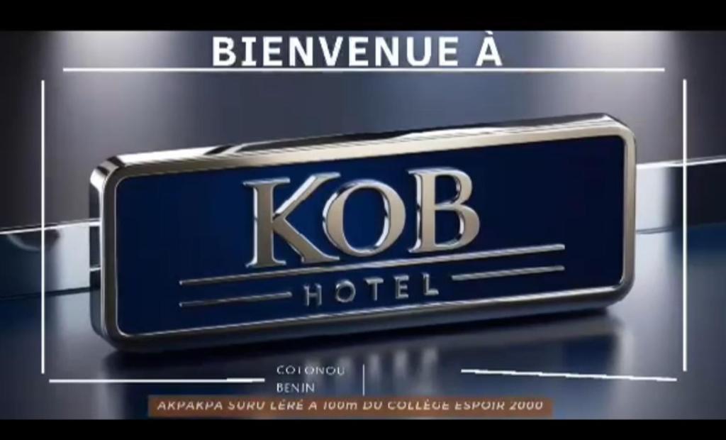 a sign for a kodel hotel on a display at HÔTEL & RÉSIDENCE KoB in Agbato