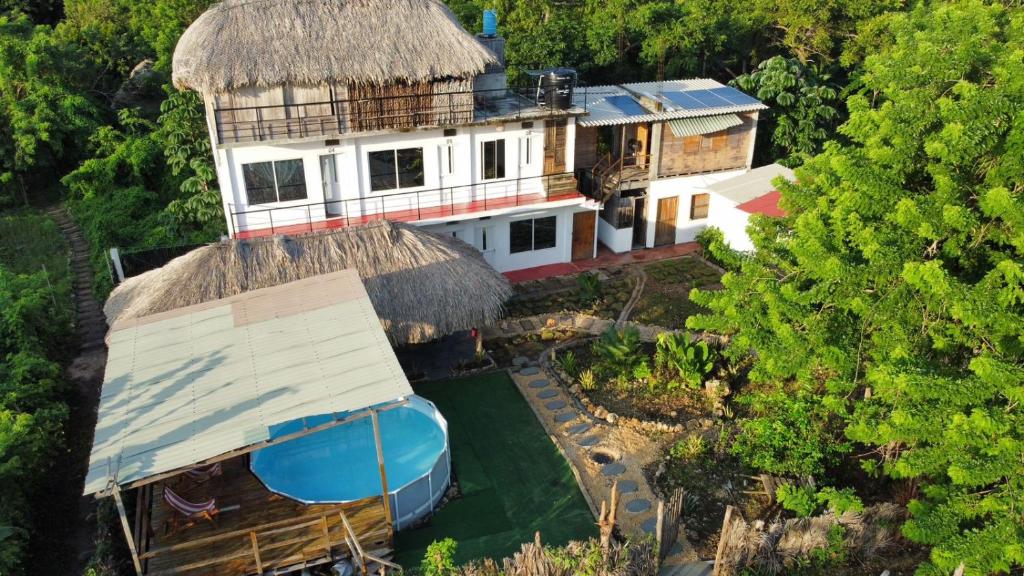an aerial view of a house with a roof at Hotel Paradise in Isla Fuerte