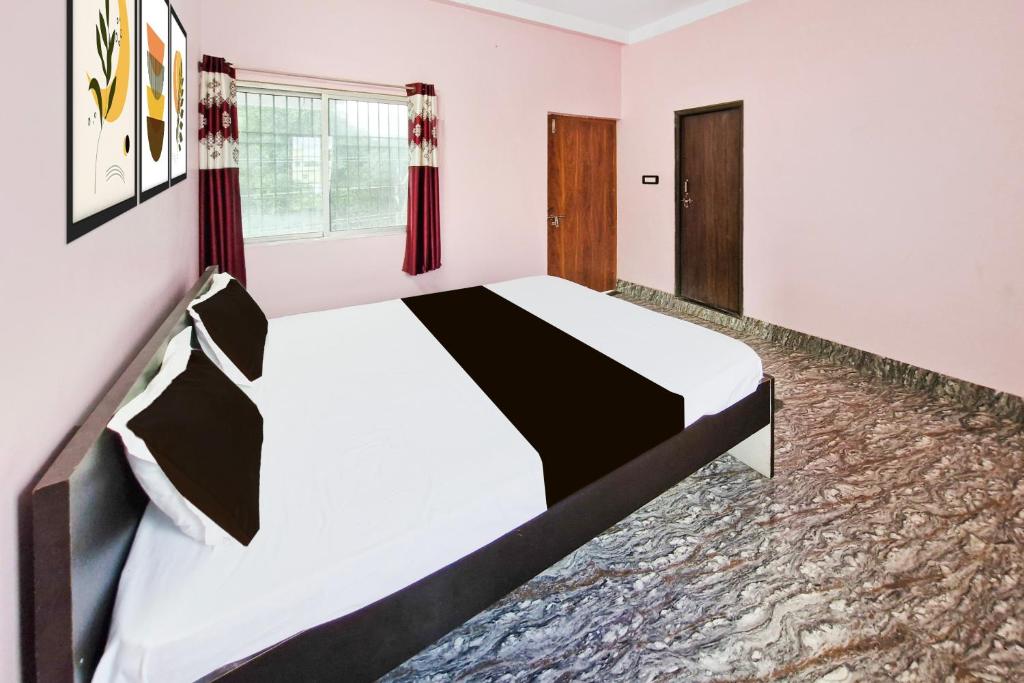 Ένα ή περισσότερα κρεβάτια σε δωμάτιο στο Hotel O Royal Heritage Resort