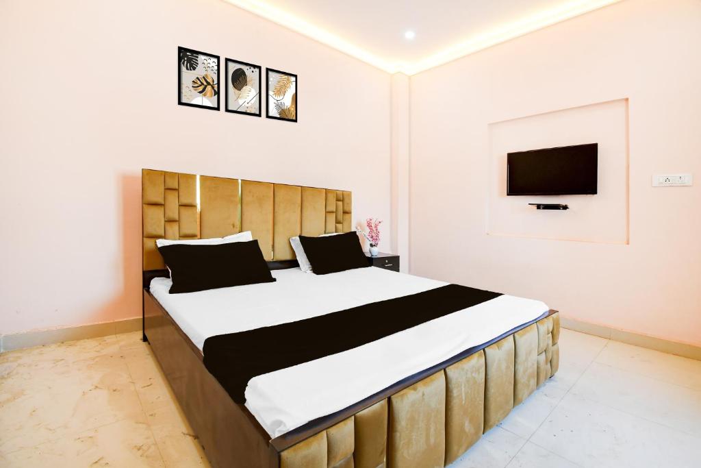 En eller flere senge i et værelse på Hotel O Valencia Stay