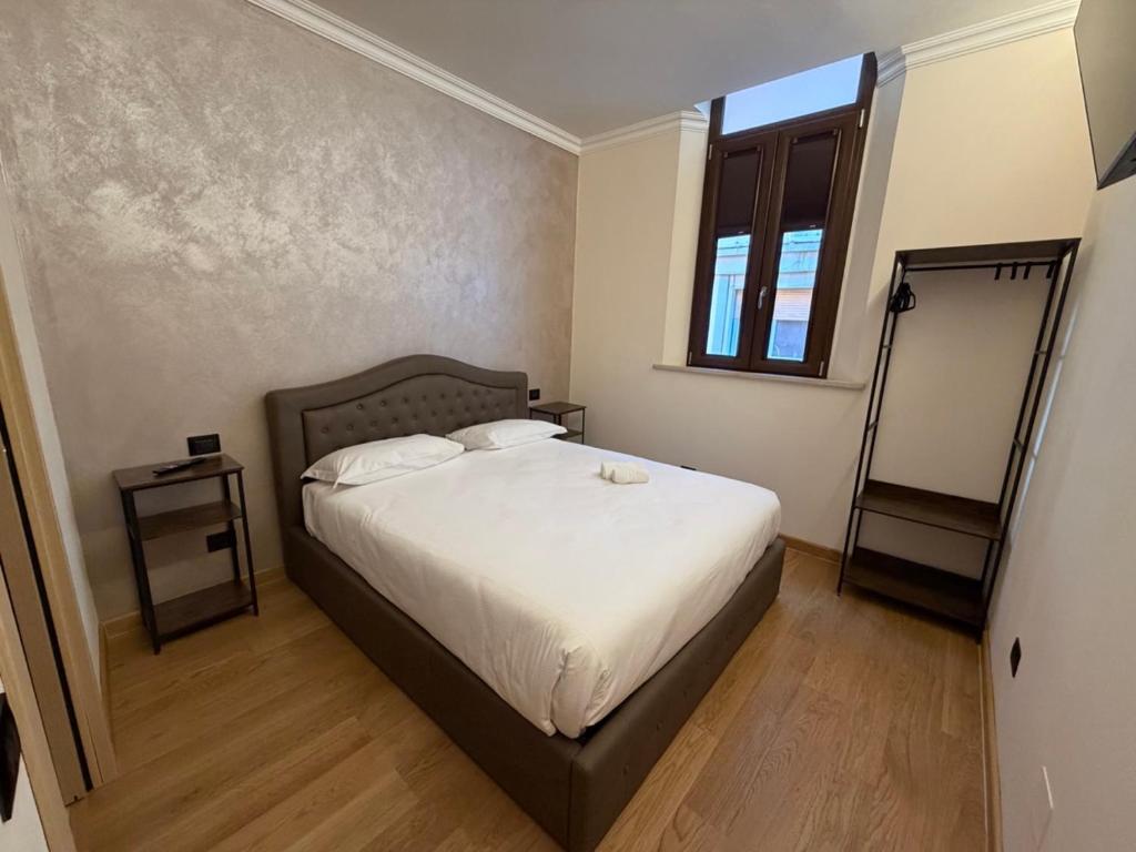 Ένα ή περισσότερα κρεβάτια σε δωμάτιο στο Le Stanze Del Duca