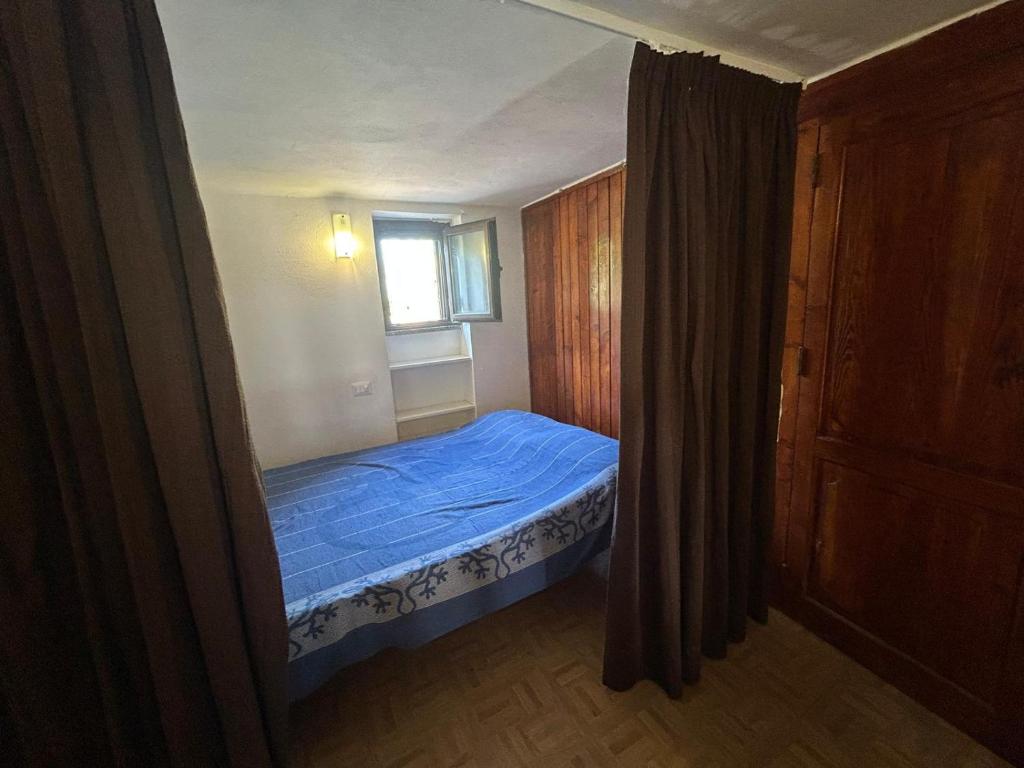 Ένα ή περισσότερα κρεβάτια σε δωμάτιο στο Vulcano Island Houses