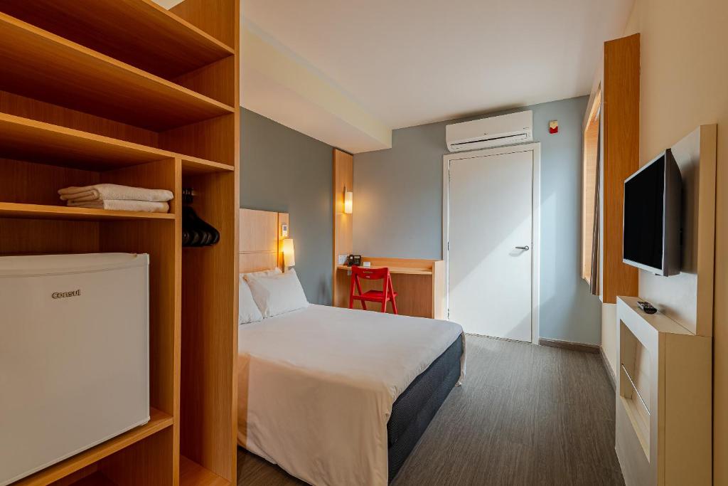 Postel nebo postele na pokoji v ubytování Transamerica Fit Aracruz