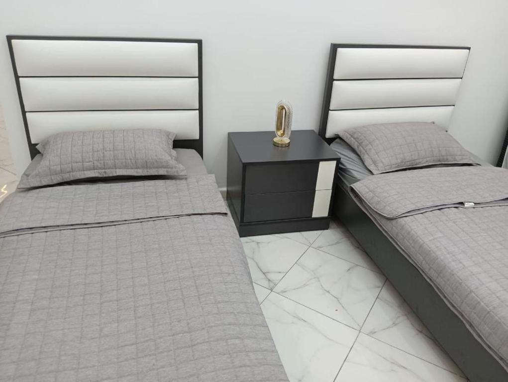 En eller flere senge i et værelse på Appartement cosy