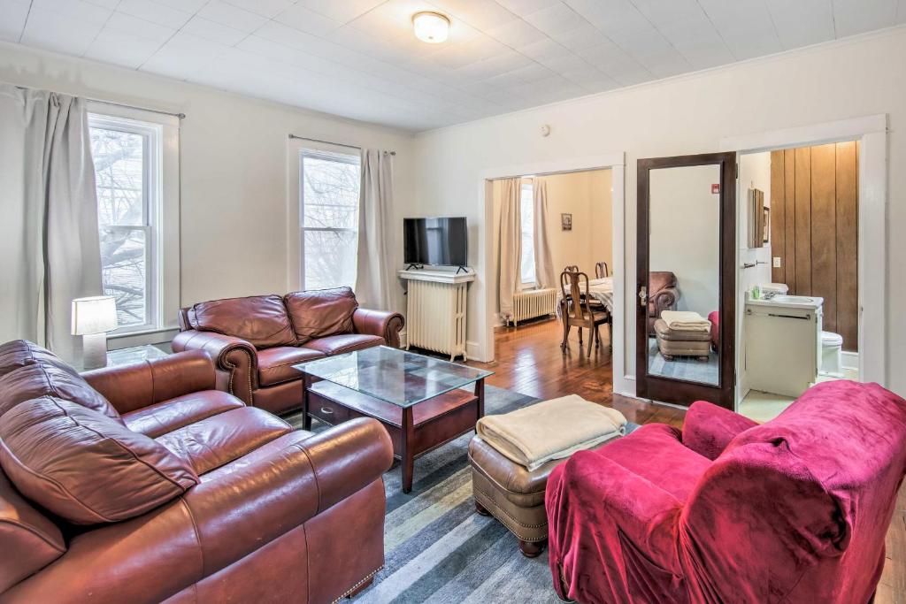 a living room with leather furniture and a table at Roomy Lancaster Home Walk to Dtwn and Hospital in Lancaster