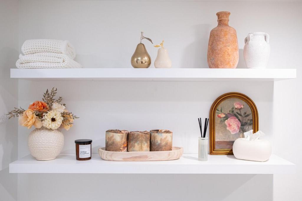 a shelf with vases and other items on it at Forest Green Retreat in Brattleboro