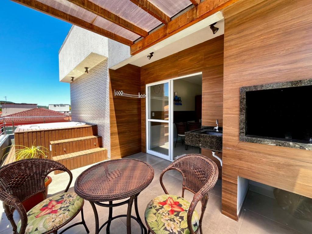 Et tv og/eller underholdning på Apartamento Duplex Palmas, 2 quartos, 7 min da praia!