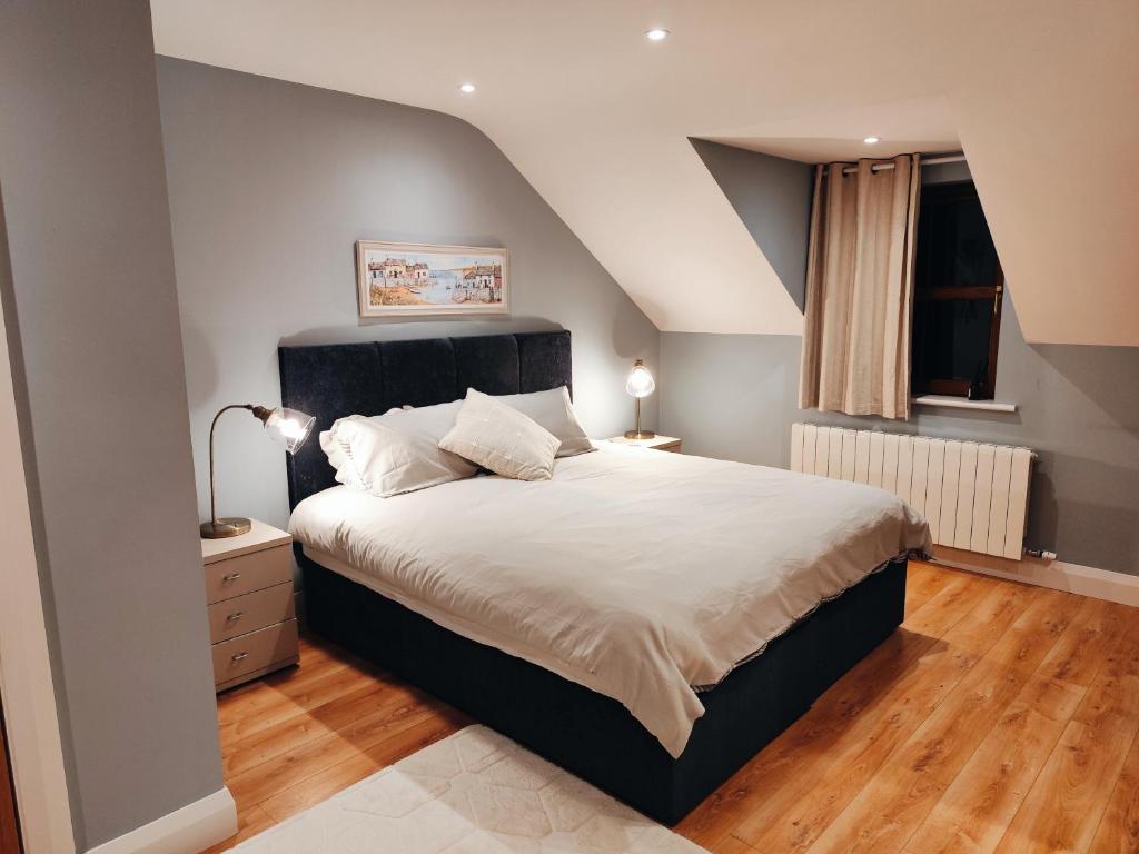 Giường trong phòng chung tại Suíomh Álainn