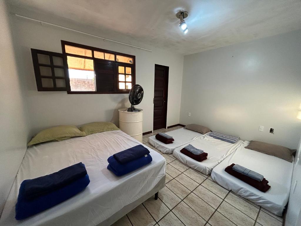 Ένα ή περισσότερα κρεβάτια σε δωμάτιο στο Hostel São Geraldo