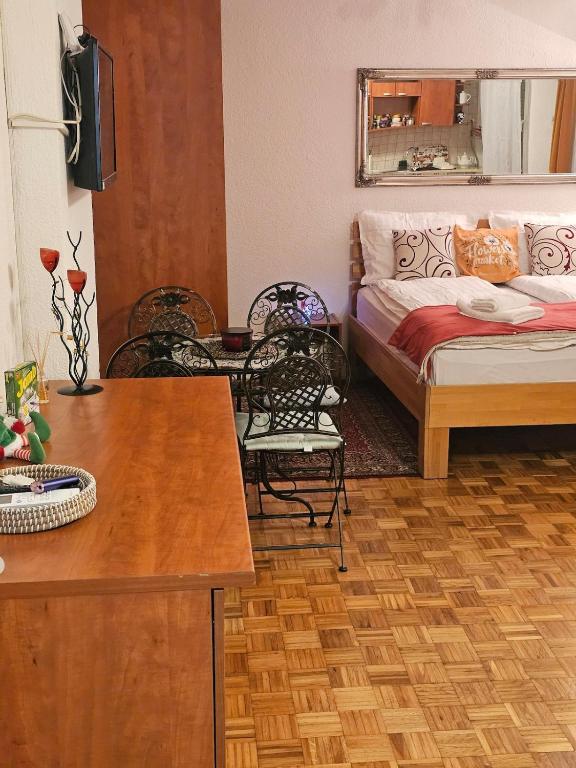 a living room with a couch and a bed at Happy apartment-OldTown Sarajevo in Sarajevo