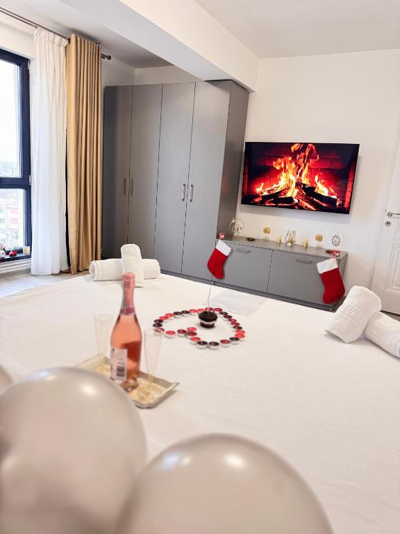 a room with a bottle of wine on a table at Erwin s Studio Sky View in Bariera Vîlcii