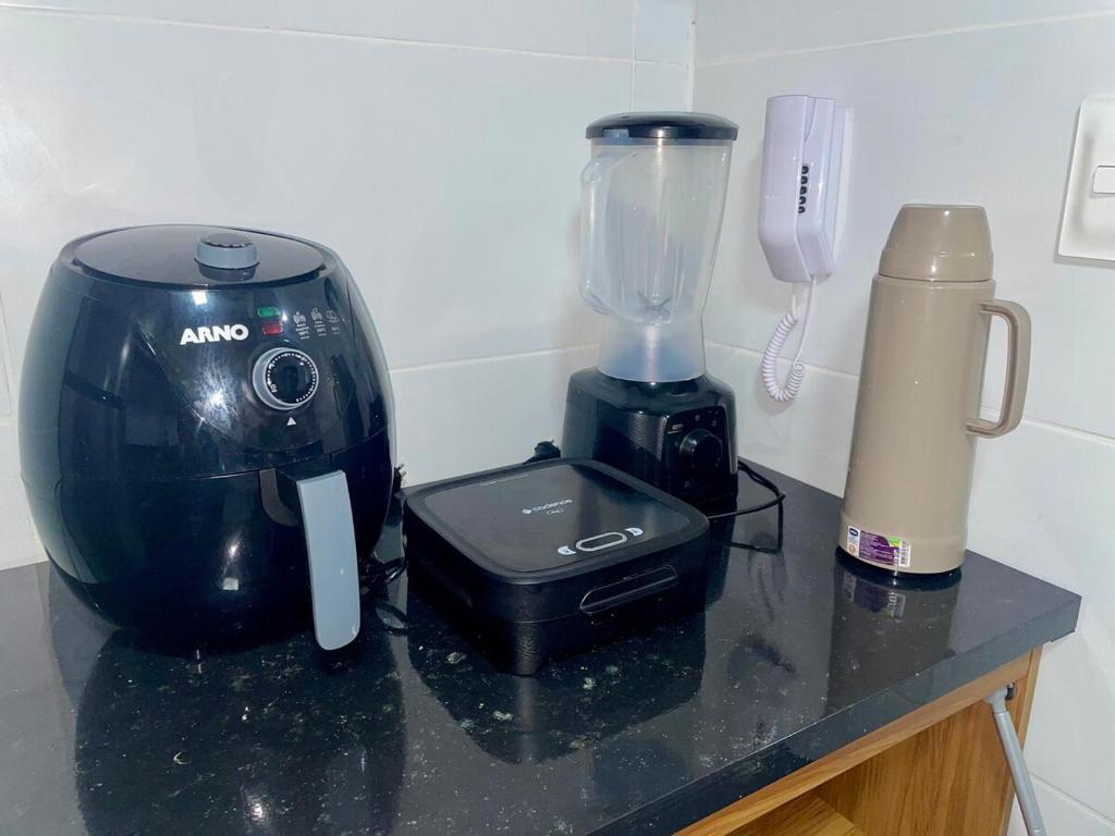 Comodidades para chá e café em Excelente apartamento a passos da praia