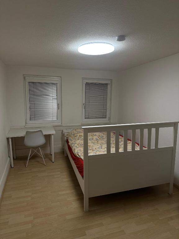 Кровать или кровати в номере Zentrales Zimmer