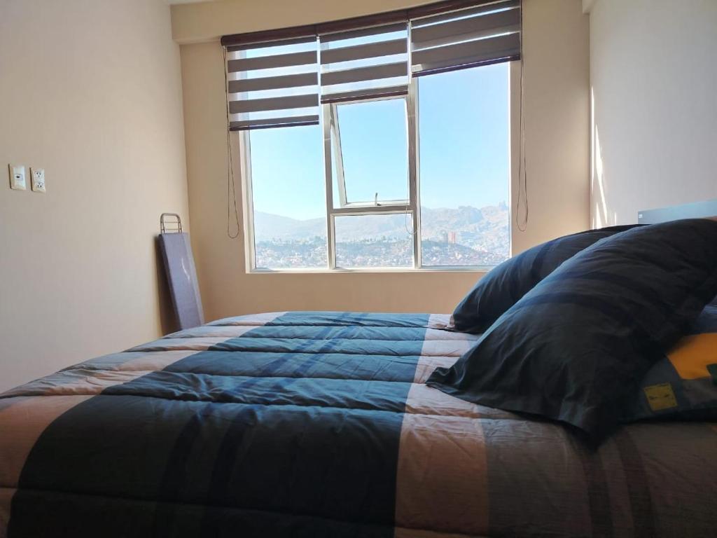 Postel nebo postele na pokoji v ubytování Acogedor y moderno apartamento, zona tranquila, vista espectacular