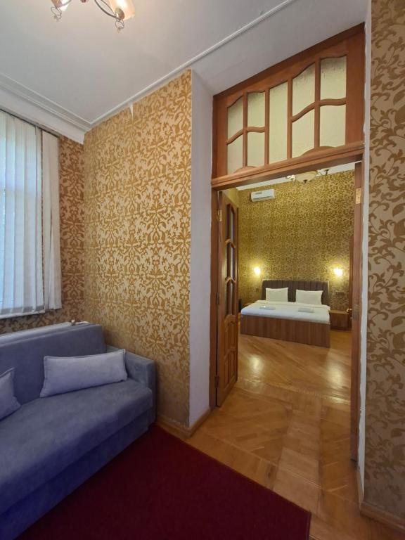 Postel nebo postele na pokoji v ubytování Hôtel Jeanne d'Arc Central